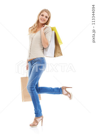Shopping bag, woman is happy with retail and fashion, customer in studio and sale on white background. Discount purchase at store, gift and smile in portrait with commercial product from market Shopping bag, woman is happy with retail and fashion, customer in studio and sale on white background. Discount purchase at store, gift and smile in portrait with commercial product from market 113344094