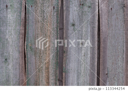 Old wooden fence with peeling paint Old wooden fence with peeling paint 113344254
