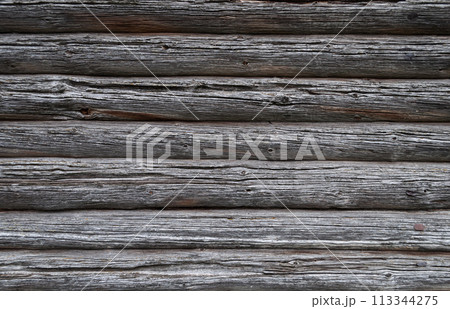 Old weathered cracked log wall background Old weathered cracked log wall background 113344275