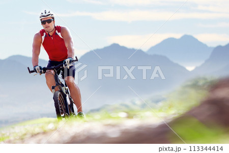Nature, exercise and man cyclist with bicycle in park for marathon, race or competition training. Fitness, sports and male athlete cycling on bike for cardio health workout outdoor by mountain. 113344414