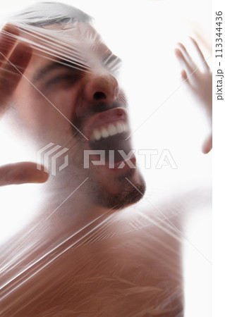 Male person, plastic and bag with choking, gasping and struggle for air in white background. Man, expression and suffocating in crisis for awareness, help and anxiety in mental health or wellness Male person, plastic and bag with choking, gasping and struggle for air in white background. Man, expression and suffocating in crisis for awareness, help and anxiety in mental health or wellness 113344436