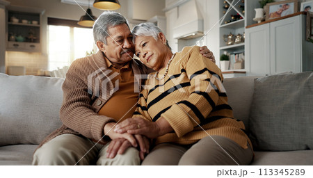 Senior, couple and hug for empathy on sofa with support, grief and comfort in living room of house. Old people, man and woman with love and embrace for security, compassion and sympathy on couch 113345289