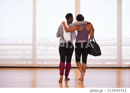 Fitness, hug and back of friends at gym walking after training, exercise or sports routine. Workout, club and women with support after morning cardio routine, challenge or bonding with conversation 113345351