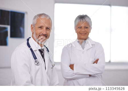 Teamwork, crossed arms and portrait of doctors in hospital for collaboration, insurance and support. Healthcare, clinic and confident man and woman smile for medical care, service and consulting 113345626
