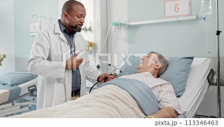 Medical stethoscope and doctor with patient in hospital after surgery, treatment or procedure. Discussion, checkup and African male healthcare worker talk to senior man in clinic bed for diagnosis. 113346463