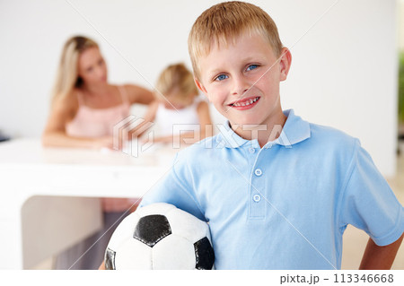 Boy, football and smiling in portrait at home for after school summer sports, training and playing with friends. Child, happy and excited for fitness exercise, soccer practice or fun workout 113346668