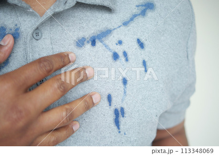shirt with blue ink stain . 113348069
