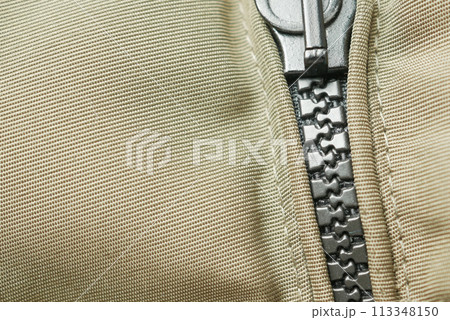 Close-up of a zipper with a slider Close-up of a zipper with a slider 113348150