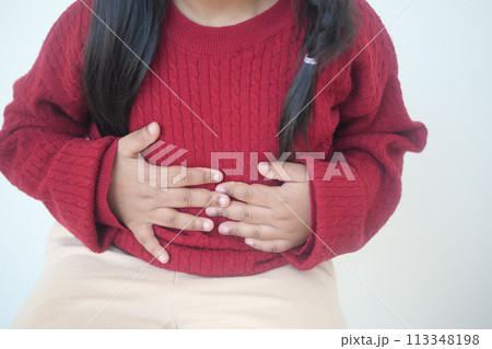 child suffering stomach pain close up. child suffering stomach pain close up. 113348198