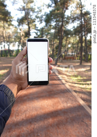 pov of young man using smart phone at outdoor  113348378