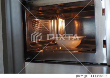 open microwave at home closeup open microwave at home closeup 113348686