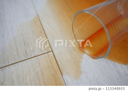 cup of coffee spilled on wooden floor cup of coffee spilled on wooden floor 113348933