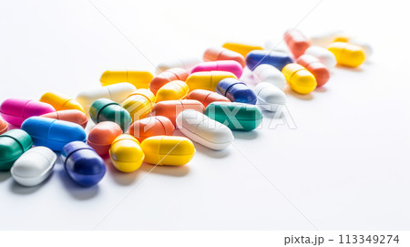 Multi-colored bright tablets on a white background. 113349274