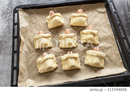 Cooking Easter rabbit-shaped buns puff pastry from sausage and cheese, step by step, step 5. 113349808