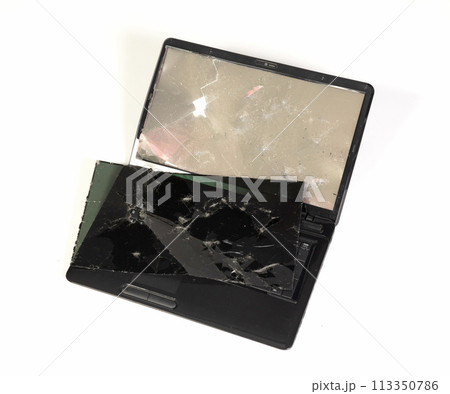 Old broken laptop isolated on white background Old broken laptop isolated on white background 113350786