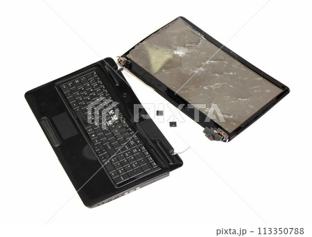 Old broken laptop isolated on white background Old broken laptop isolated on white background 113350788