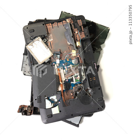 Old broken laptop isolated on white background Old broken laptop isolated on white background 113350795