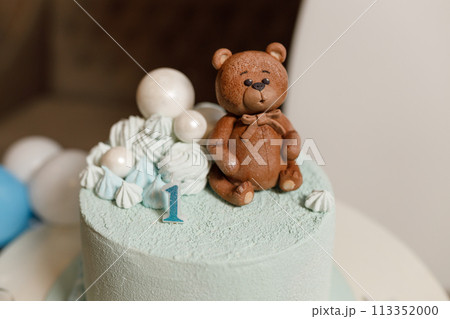 Celebratory cake for a children's birthday in blue with a teddy bear Celebratory cake for a children's birthday in blue with a teddy bear 113352000