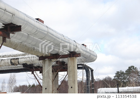 The main provides the city with hot water. Selective focus. The pipes of the central heating system 113354538