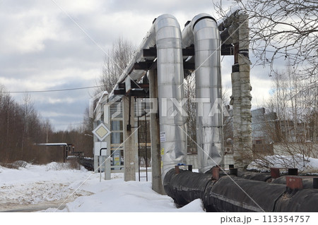 The main provides the city with hot water. Selective focus. The pipes of the central heating system 113354757
