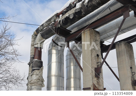 The main provides the city with hot water. Selective focus. The pipes of the central heating system The main provides the city with hot water. Selective focus. The pipes of the central heating system 113354809