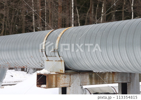 The main provides the city with hot water. Selective focus. The pipes of the central heating system 113354815