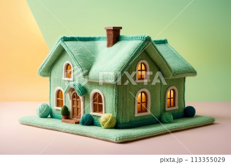 model of a house in a knitted style, concept: insulated house 113355029