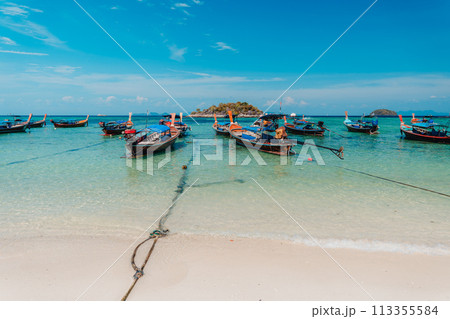 Wooden boat on the beach on the island 113355584