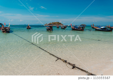 Wooden boat on the beach on the island 113355587