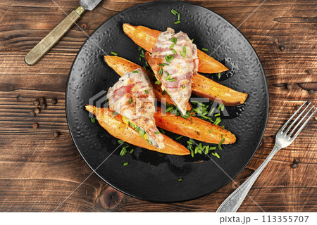 Meat roulade and roasted sweet potatoes. Meat roulade and roasted sweet potatoes. 113355707