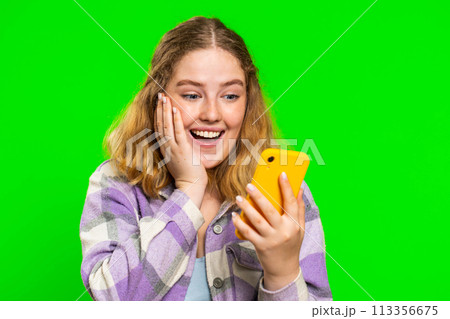 Happy excited winner woman use smartphone celebrating success, winning play game, good lottery news 113356675