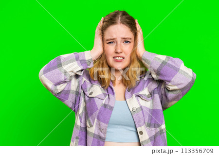 Annoyed irritated young woman covering ears gesturing no avoiding advice ignoring noise loud voices 113356709
