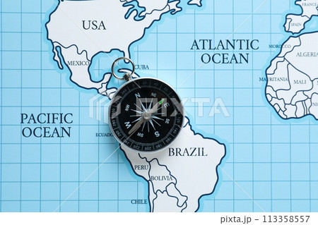 Compass on the background of the world map. 113358557