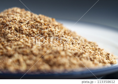 Milk Thistle seeds powder in plate. Ground Silybum Marianum herb. Herbal healing supplement. Milk Thistle seeds powder in plate. Ground Silybum Marianum herb. Herbal healing supplement. 113358612