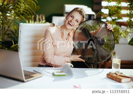 happy modern bookkeeper woman in modern green office happy modern bookkeeper woman in modern green office 113358851