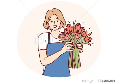 Positive woman flower seller stands with luxurious bouquet and smiling looks at camera 113360804