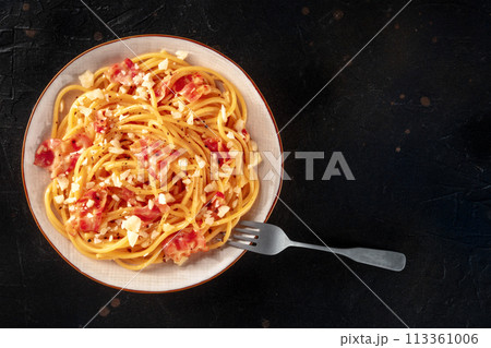 Carbonara pasta dish, traditional Italian spaghetti with pancetta and cheese Carbonara pasta dish, traditional Italian spaghetti with pancetta and cheese 113361006