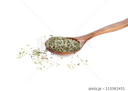Dried thyme herb on wooden spoon and on white background. 113361451
