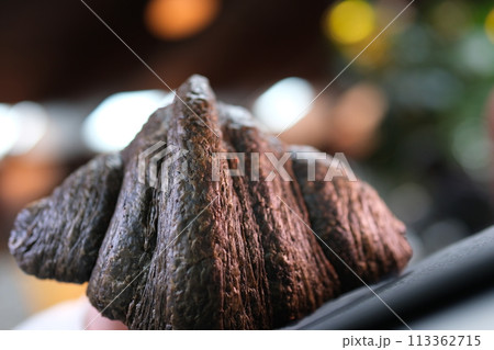 Extreme close up view of morning breakfast, lunch. Rotation view of served cup of coffee with milk, crispy croissants and milk. Perfect morning, daily routine. Cozy atmosphere. High quality 4k  113362715