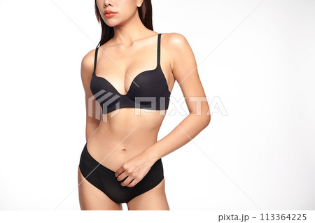 Confident beautiful young asian woman posing in black lingerie on white background, Perfect body, 113364225