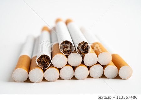 Cigarette on US dollar banknotes, cost, trading, marketing and production, No smoking, imort export concept. Cigarette on US dollar banknotes, cost, trading, marketing and production, No smoking, imort export concept. 113367486