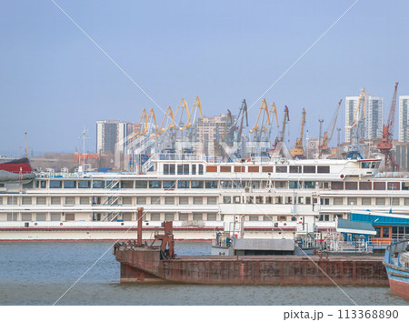 View to river port with vessels and harbor cranes. View to river port with vessels and harbor cranes. 113368890