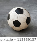 Dirty Soccer Ball Isolated on Outdoor Background 113369137
