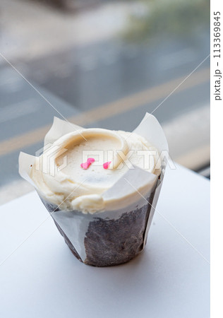 Closeup chocolate cupcake with a vanilla buttercream frosting Closeup chocolate cupcake with a vanilla buttercream frosting 113369845