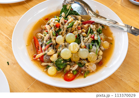 Stir fried spicy catfish roe and Razor clam with Thai herbs 113370029