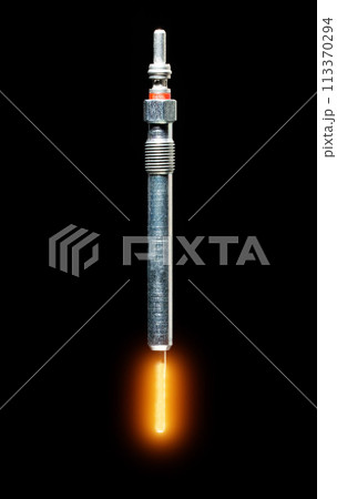 Modern glow plug with a ceramic rod for a diesel engine on a black background, isolate, close-up. Heating element of the combustion chamber of a car, starting the engine in cold temperatures in winter 113370294