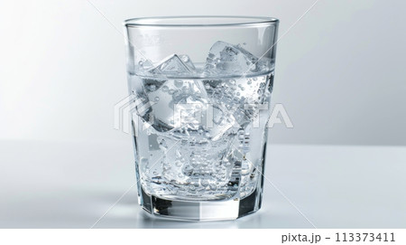 Glass of cold water with ice cubes, perfect refreshment for a hot summer day on a white background Glass of cold water with ice cubes, perfect refreshment for a hot summer day on a white background 113373411