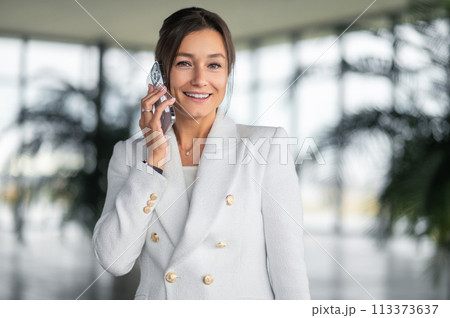 Business woman communication with the client on the phone and looking involved Business woman communication with the client on the phone and looking involved 113373637