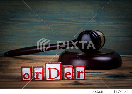 ORDER. Red alphabet letters and judge's gavel on wooden background. laws and justice concept ORDER. Red alphabet letters and judge's gavel on wooden background. laws and justice concept 113374180