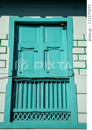 Beautiful facade of the houses at the historical downtown of the heritage town of Salamina located at the Caldas department in Colombia. 113375072